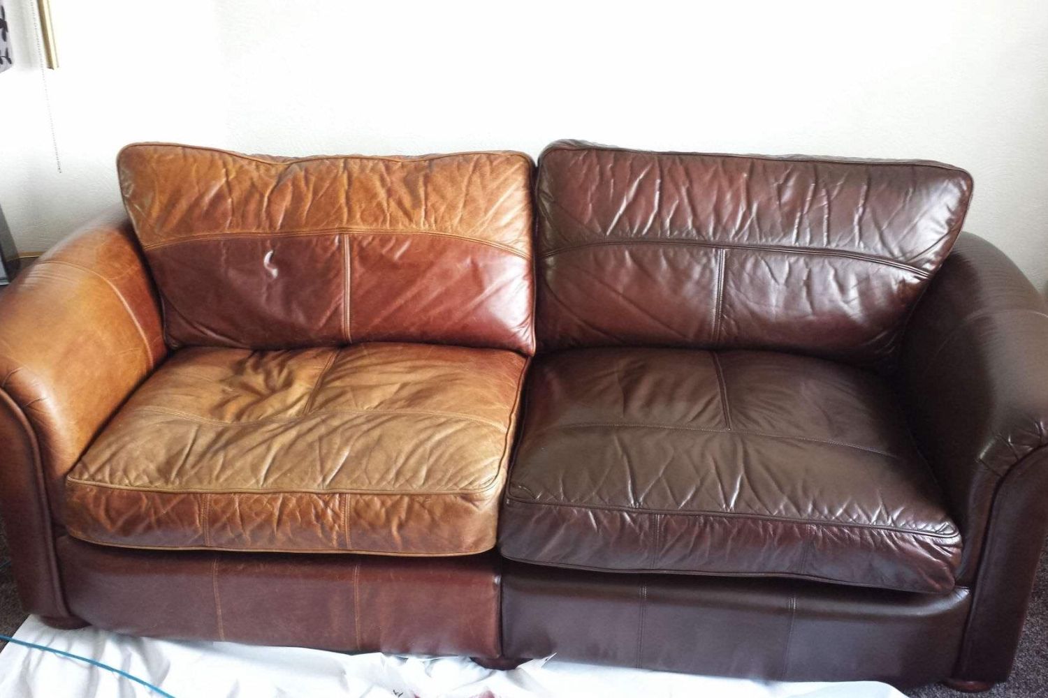 A contemporary leather couch with two seats, providing a stylish and inviting atmosphere for relaxation.