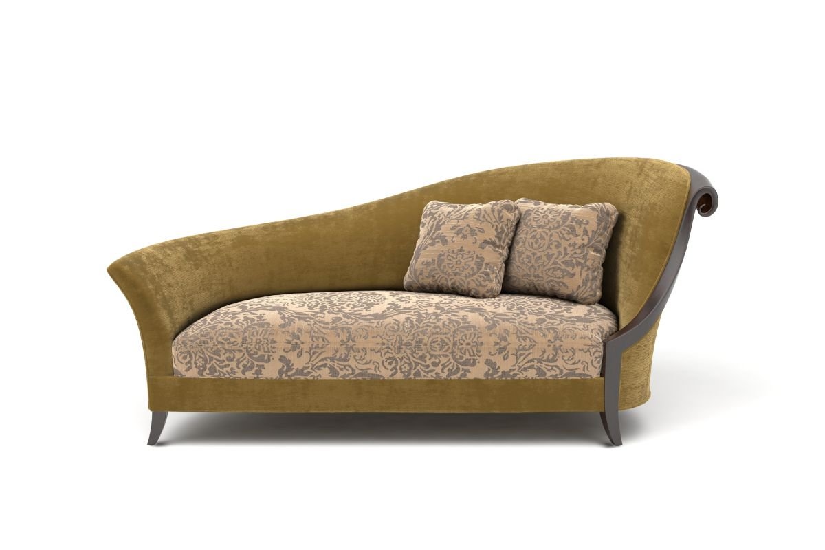 A cozy couch adorned with a decorative pillow and a soft cushion, inviting relaxation in a warm living space. 